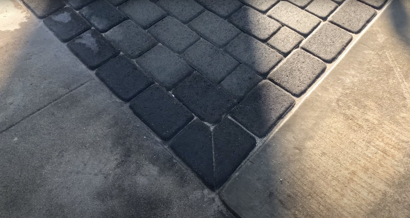 Detailed view of decorative concrete paver installation showing precision craftsmanship